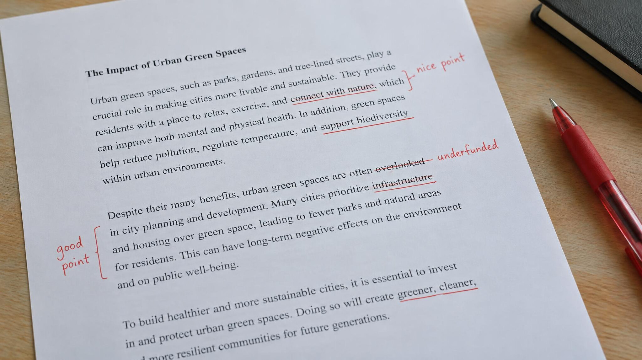 Printed document with handwritten annotations and a red pen